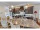 Modern kitchen island with granite countertops and stainless steel appliances at 153 Bywood Dr, Roxboro, NC 27573