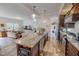 Modern kitchen featuring stainless steel appliances, a large island, and an open view to the living room at 153 Bywood Dr, Roxboro, NC 27573