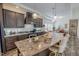 Stylish kitchen featuring granite countertops, dark wood cabinets, and pendant lighting at 153 Bywood Dr, Roxboro, NC 27573