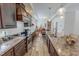 Well-equipped kitchen features granite countertops, and wood cabinets at 153 Bywood Dr, Roxboro, NC 27573