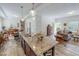 Open-concept kitchen boasts a large island with granite countertops and modern pendant lighting at 153 Bywood Dr, Roxboro, NC 27573