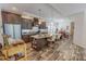 Spacious kitchen featuring an island with seating, granite countertops, and stainless steel appliances at 153 Bywood Dr, Roxboro, NC 27573