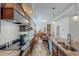 Bright kitchen features stainless steel appliances, lots of counter space, and wood look floors at 153 Bywood Dr, Roxboro, NC 27573