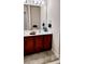 Bathroom featuring double sinks, a large mirror, and ample counter space for toiletries at 1633 Snow Mass Way, Durham, NC 27713