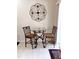 Charming breakfast nook with a glass-top table and comfortable seating, perfect for casual dining at 1633 Snow Mass Way, Durham, NC 27713