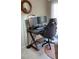 A functional home office with dual monitors, comfortable chair, and natural light from the window at 1633 Snow Mass Way, Durham, NC 27713