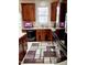 Functional kitchen featuring ample cabinetry, modern appliances, and stylish geometric-patterned rug at 1633 Snow Mass Way, Durham, NC 27713