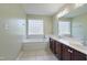 Bright bathroom features a soaking tub and double sink vanity with tile flooring at 169 Clearwater Harbor Hbr, Sanford, NC 27332