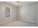 Bedroom with neutral carpet, ceiling fan, and a large window for natural light at 169 Clearwater Harbor Hbr, Sanford, NC 27332