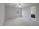 Neutral bedroom with carpet flooring, ceiling fan, and access to bathroom at 169 Clearwater Harbor Hbr, Sanford, NC 27332