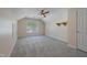 Upstairs bedroom with neutral carpet, dormer ceiling, window and ceiling fan at 169 Clearwater Harbor Hbr, Sanford, NC 27332