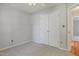 Bedroom with neutral carpet and a double-door closet with bright trim at 169 Clearwater Harbor Hbr, Sanford, NC 27332