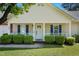 Home's inviting front porch with green shrubs, bright white railings and front door at 169 Clearwater Harbor Hbr, Sanford, NC 27332