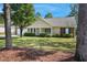 Inviting one-story home with a cozy front porch, green lawn, mature trees and an attached two car garage at 169 Clearwater Harbor Hbr, Sanford, NC 27332