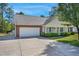 Charming single-story home with a well-manicured lawn, a two-car garage, and a welcoming front porch at 169 Clearwater Harbor Hbr, Sanford, NC 27332