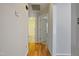 Hallway with wood flooring, neutral walls, and access to rooms at 169 Clearwater Harbor Hbr, Sanford, NC 27332