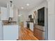 Spacious kitchen with stainless steel appliances, white cabinetry, and granite countertops at 169 Clearwater Harbor Hbr, Sanford, NC 27332
