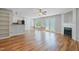 Open floor plan with fireplace, wood flooring, and plenty of natural light at 169 Clearwater Harbor Hbr, Sanford, NC 27332