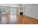 Living room area featuring a fireplace, wood floors, and french doors at 169 Clearwater Harbor Hbr, Sanford, NC 27332