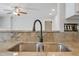 Close-up of a stainless steel sink with granite countertops and a modern faucet at 169 Clearwater Harbor Hbr, Sanford, NC 27332