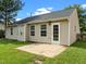The home features a backyard with a concrete patio and white door at 1728 E Honey Springs Ave, Fuquay Varina, NC 27526