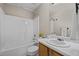 Well-lit bathroom featuring a vanity, toilet, and shower over tub at 1728 E Honey Springs Ave, Fuquay Varina, NC 27526