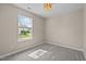 Carpeted bedroom with a window providing natural light at 1728 E Honey Springs Ave, Fuquay Varina, NC 27526
