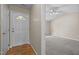 Inviting foyer leading to a carpeted room with a ceiling fan and ample natural light at 1728 E Honey Springs Ave, Fuquay Varina, NC 27526