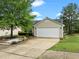 Well-maintained one-story home with a two-car garage, driveway and manicured front yard at 1728 E Honey Springs Ave, Fuquay Varina, NC 27526