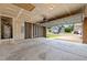 Spacious garage with an open door, water heater, and electrical panel at 1728 E Honey Springs Ave, Fuquay Varina, NC 27526