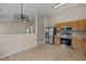 Open concept kitchen with stainless steel appliances and light wood cabinets at 1728 E Honey Springs Ave, Fuquay Varina, NC 27526