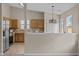 Open-concept kitchen with granite countertops and stainless steel appliances at 1728 E Honey Springs Ave, Fuquay Varina, NC 27526