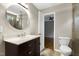 Bathroom with a marble vanity, modern fixtures, and views into the bedroom at 18 Gwendolyn Cir, Durham, NC 27703