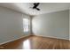 Bright bedroom with hardwood floors, large window, and ceiling fan at 18 Gwendolyn Cir, Durham, NC 27703