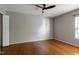 Bedroom showcasing beautiful hardwood floors, ceiling fan, and plenty of natural light at 18 Gwendolyn Cir, Durham, NC 27703