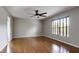 Bright bedroom with ceiling fan, hardwood floors and plenty of natural light at 18 Gwendolyn Cir, Durham, NC 27703