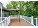 Large deck with a gazebo and white railing at 18 Gwendolyn Cir, Durham, NC 27703