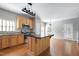 Modern kitchen with stainless steel appliances, granite countertops, a center island, and wooden cabinets at 18 Gwendolyn Cir, Durham, NC 27703