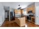 Stylish kitchen featuring stainless steel appliances, granite countertops, an island, and plenty of cabinet space at 18 Gwendolyn Cir, Durham, NC 27703