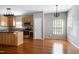 Bright kitchen featuring stainless steel appliances, wood cabinets and hardwood floors at 18 Gwendolyn Cir, Durham, NC 27703
