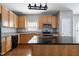 Well-equipped kitchen with stainless steel appliances, granite countertops, and ample wooden cabinetry at 18 Gwendolyn Cir, Durham, NC 27703