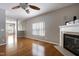 Inviting living room with fireplace, hardwood floors, and large windows at 18 Gwendolyn Cir, Durham, NC 27703