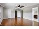 Large main bedroom boasting ceiling fan, hardwood floors, and ensuite bathroom at 18 Gwendolyn Cir, Durham, NC 27703