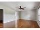 Spacious main bedroom features a ceiling fan, hardwood floors and walk-in closet at 18 Gwendolyn Cir, Durham, NC 27703