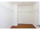 Spacious walk-in closet with wire shelving and hardwood floors, perfect for organizing clothes at 18 Gwendolyn Cir, Durham, NC 27703