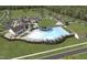 An aerial view of a community pool, clubhouse, and surrounding neighborhood at 2006 Kapalua Way # 190, Durham, NC 27703