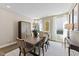 Elegant dining room featuring stylish decor, modern lighting, and natural light at 2006 Kapalua Way # 190, Durham, NC 27703