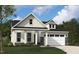Charming single-Gathering home featuring stone accents, a two-car garage, and a beautifully landscaped front yard at 2006 Kapalua Way # 190, Durham, NC 27703