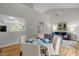 Dining area with a view of the living room, hardwood floors, and neutral paint at 205 Town Creek Dr, Cary, NC 27519