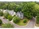 Charming gray two-story home with lush green surroundings and well-maintained landscaping at 205 Town Creek Dr, Cary, NC 27519